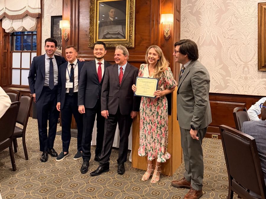 Milda Vitosytė holding her ITI Education Week certificate at Harvard